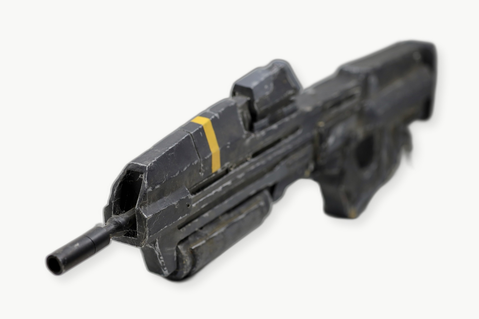 Front quarter view of the weathered Dawn Under Heaven assault rifle prop