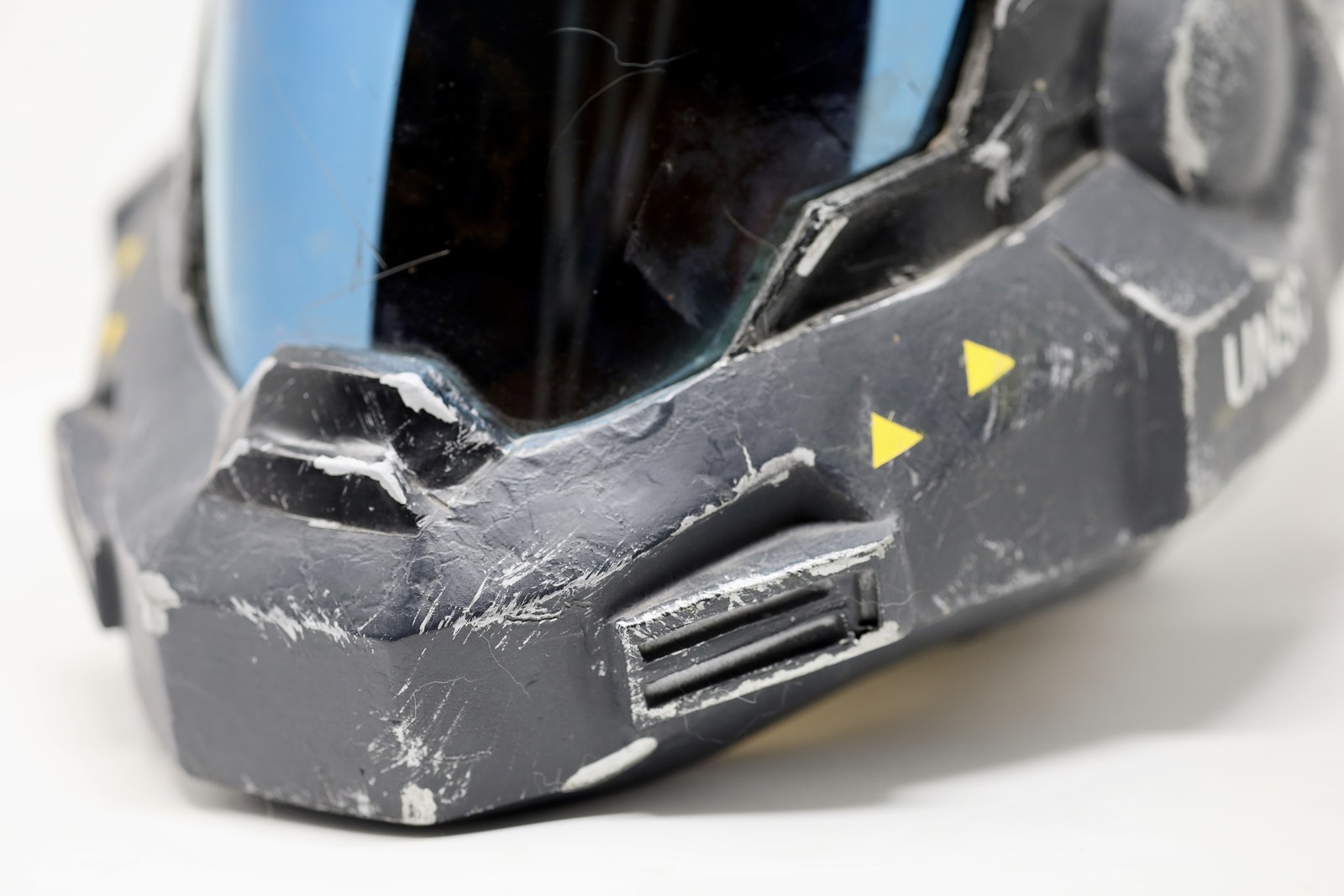 Close side view of the Dawn Under Heaven Reach-style helmet prop showing visor and cheek details