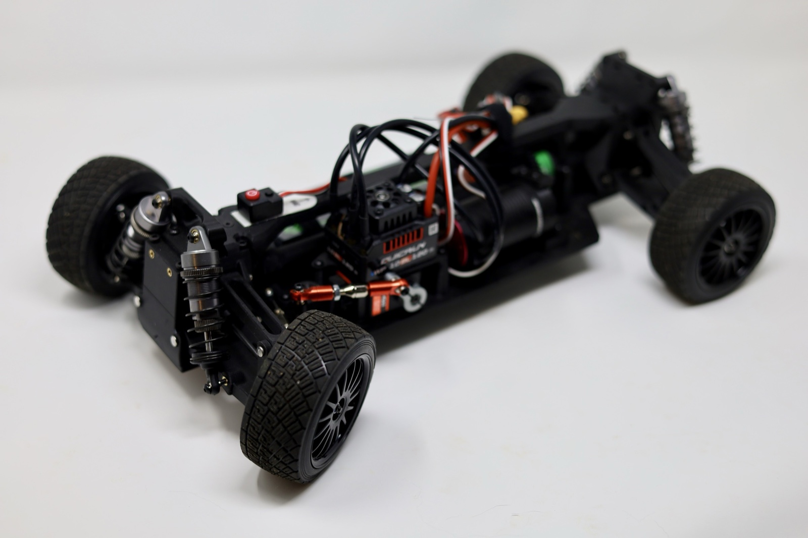 Front quarter view of a 3D printed RC car chassis with exposed electronics