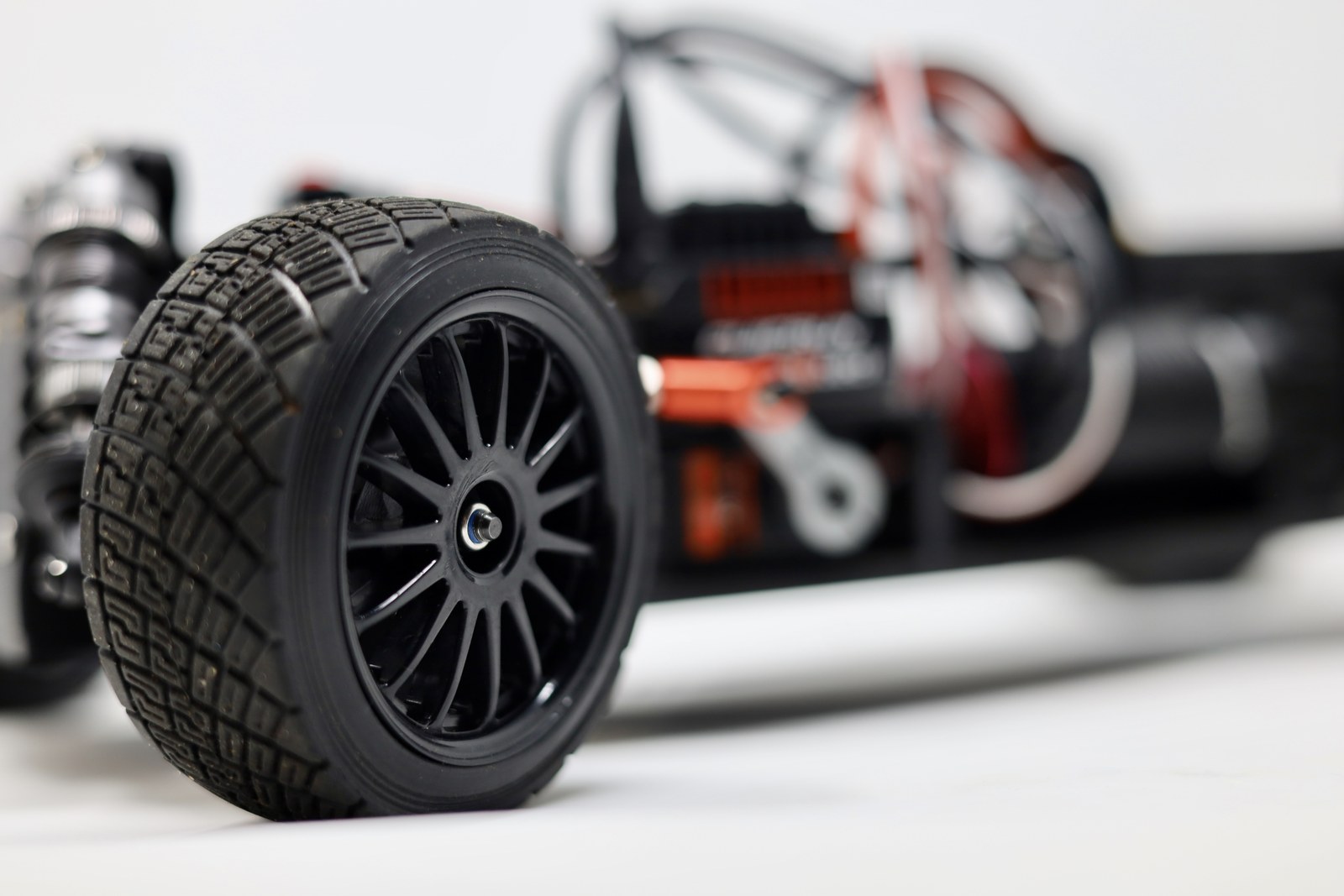 Close-up of the wheel and tire on the 3D printed RC car chassis
